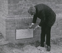 Dean Anderson lays the Cornerstone - Photographer: Carl Schramm, Charles Beatty Papers